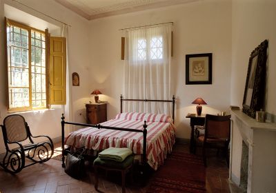 Una camera da letto dell'appartamento Certino-I a Grotti - Agriturismo a 12 km da Siena, in Toscana